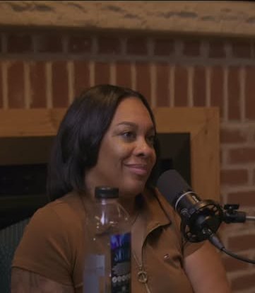 Felecia Gordon at the mic on the set of The Human Mosaic Podcast